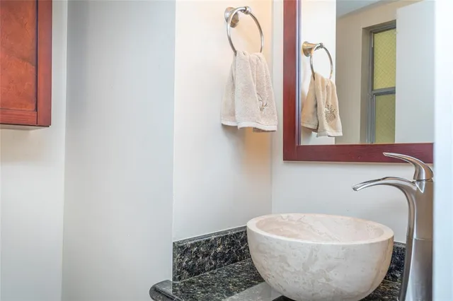 a bathroom with a sink and a mirror