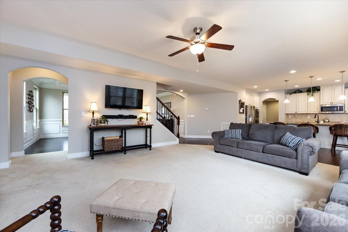 7335 Millstone Circle Southwest Concord, NC 28025 - Photo 11 of 40 a living room with furniture and kitchen view