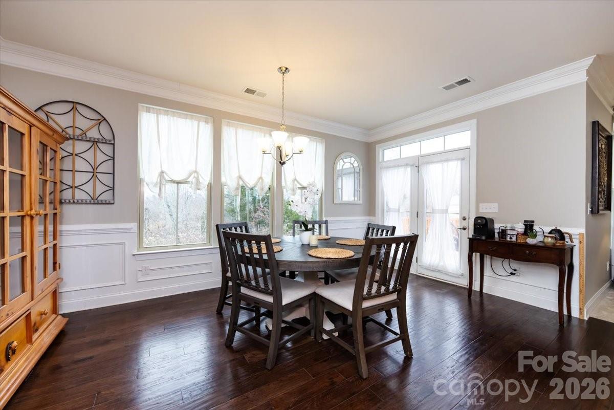 7335 Millstone Circle Southwest Concord, NC 28025 - Photo 17 of 40 a view of a dining room with furniture window and wooden floor