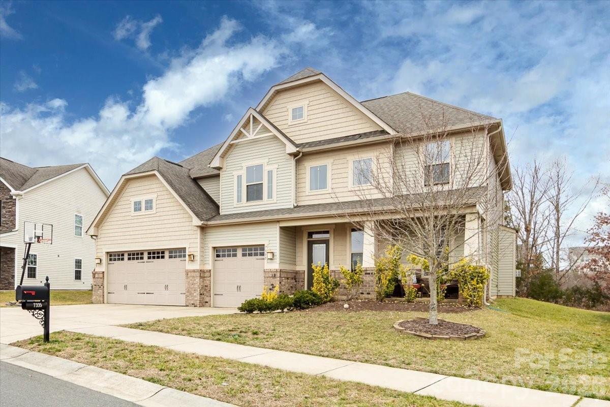 7335 Millstone Circle Southwest Concord, NC 28025 - Photo 2 of 40 front view of a house with a yard
