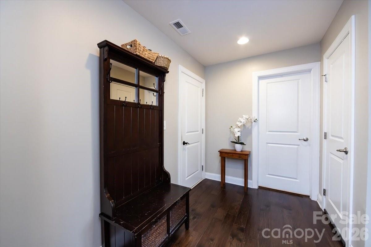 7335 Millstone Circle Southwest Concord, NC 28025 - Photo 21 of 40 a view of an entryway with wooden floor