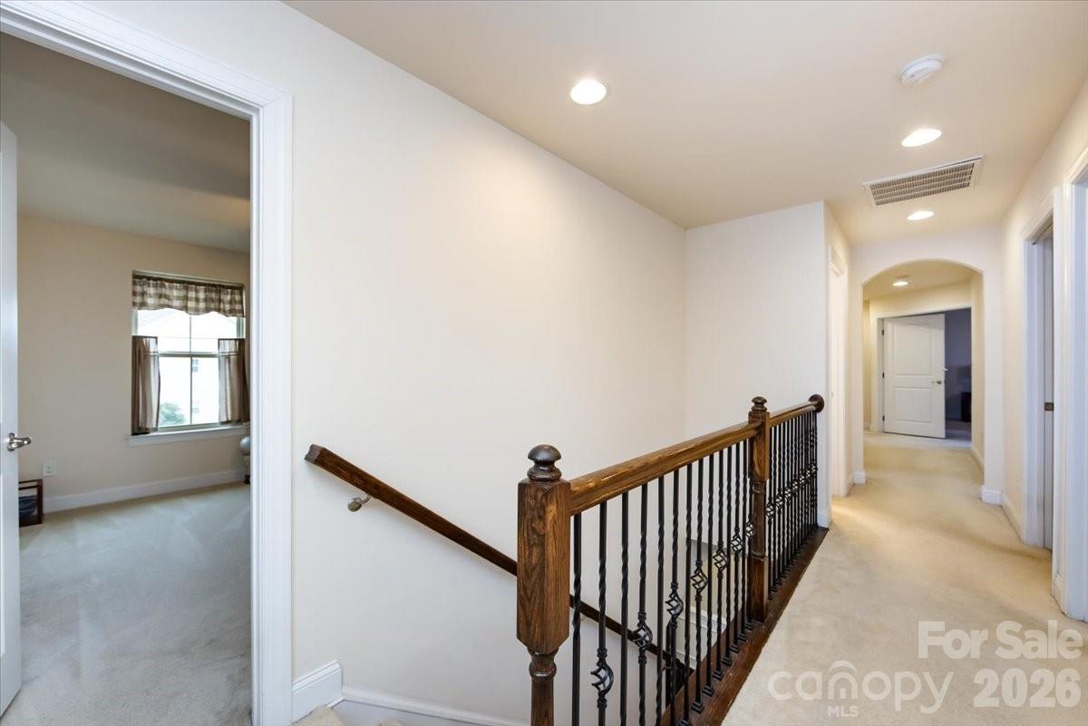 7335 Millstone Circle Southwest Concord, NC 28025 - Photo 23 of 40 a view of a hallway view with staircase