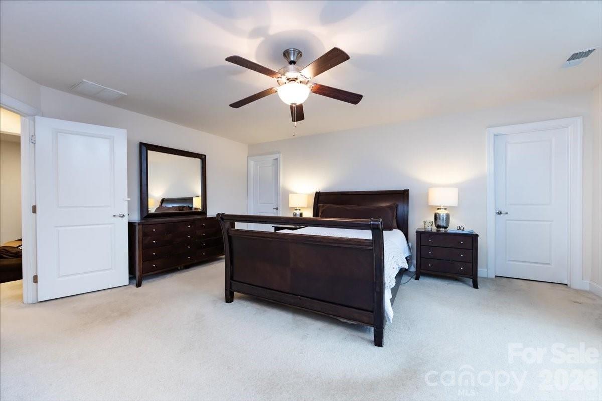 7335 Millstone Circle Southwest Concord, NC 28025 - Photo 24 of 40 a living room with furniture and a ceiling fan