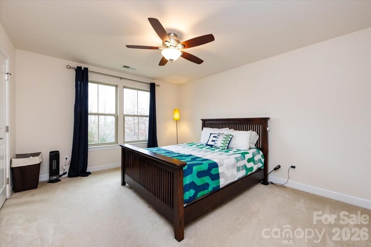 7335 Millstone Circle Southwest Concord, NC 28025 - Photo 28 of 40 a bedroom with a bed and window