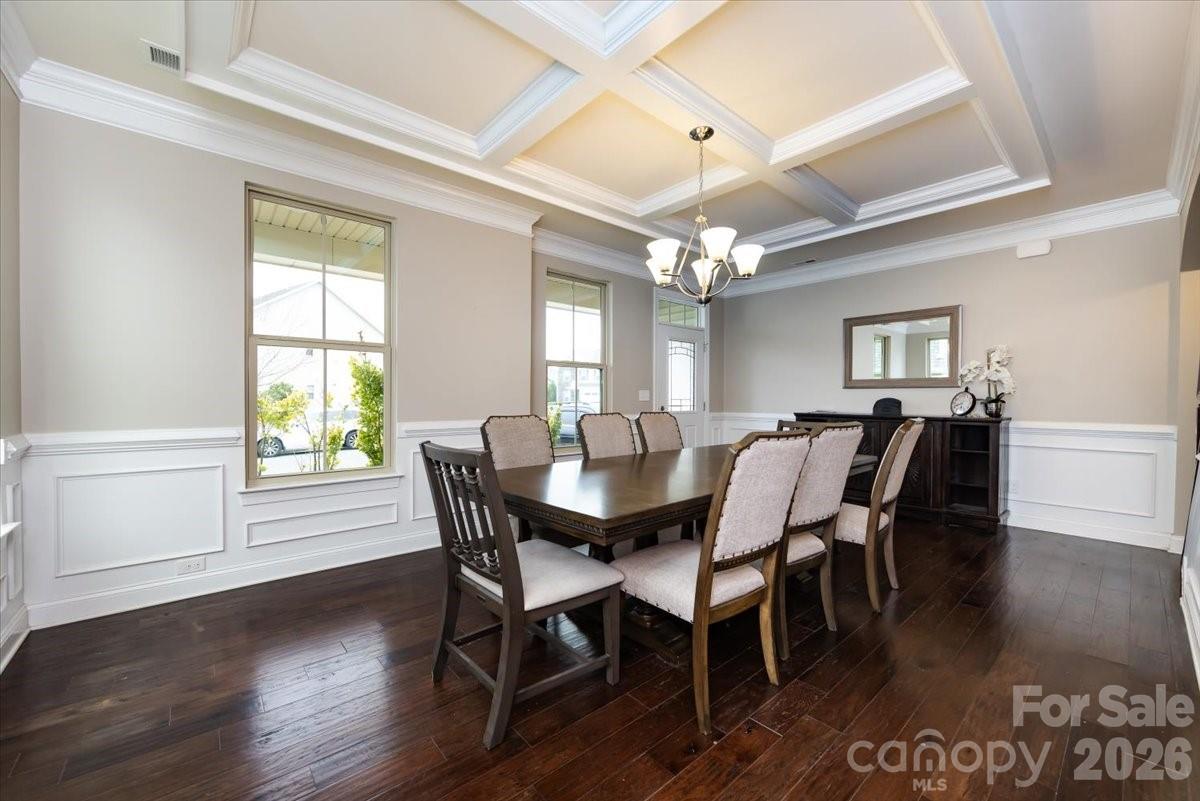 7335 Millstone Circle Southwest Concord, NC 28025 - Photo 5 of 40 a view of a dining room with furniture window and wooden floor