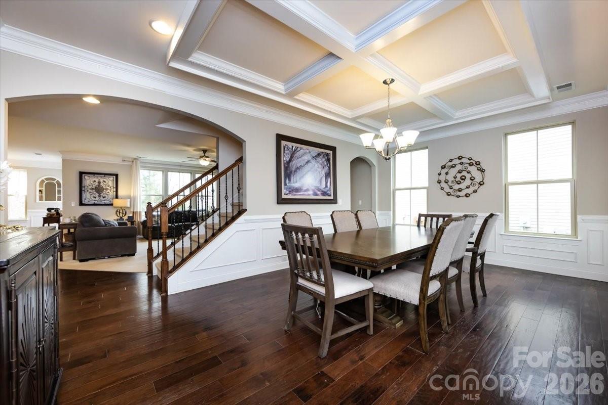 7335 Millstone Circle Southwest Concord, NC 28025 - Photo 6 of 40 a view of a dining room with furniture window and wooden floor