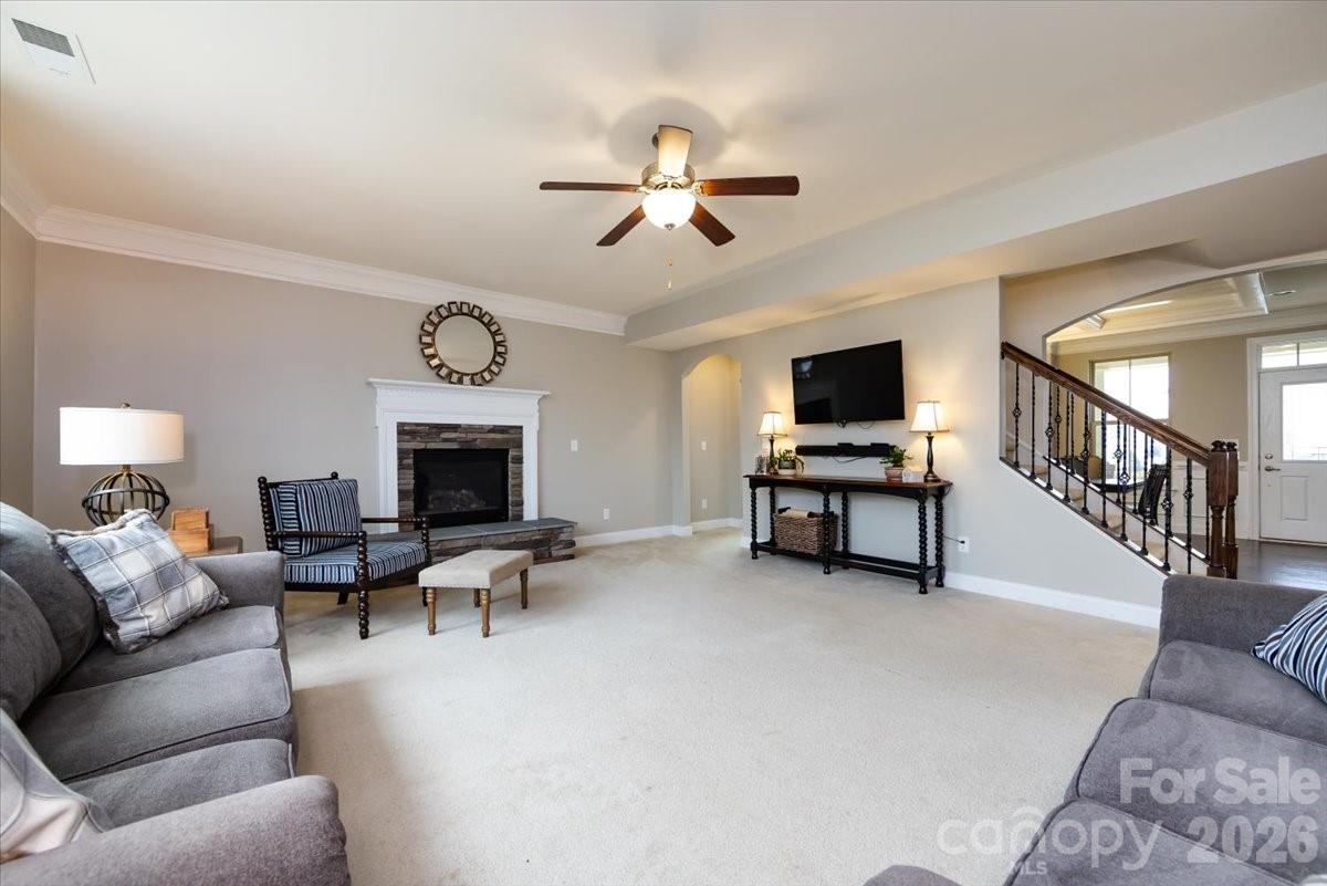 7335 Millstone Circle Southwest Concord, NC 28025 - Photo 10 of 40 a living room with furniture and a fireplace