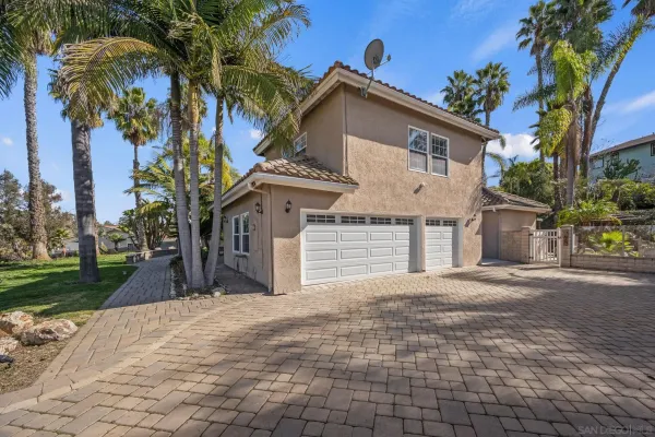 a bathroom with a granite countertop sink and a bathtub