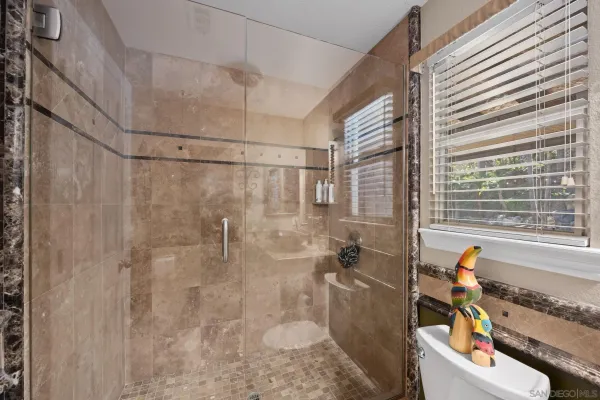a kitchen with stainless steel appliances granite countertop a sink and a stove