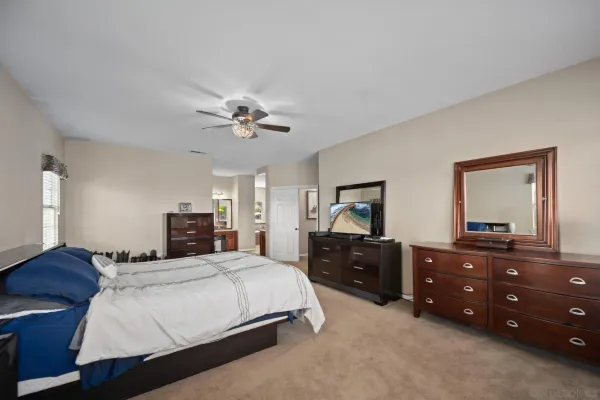 a couple of cars parked in front of a house