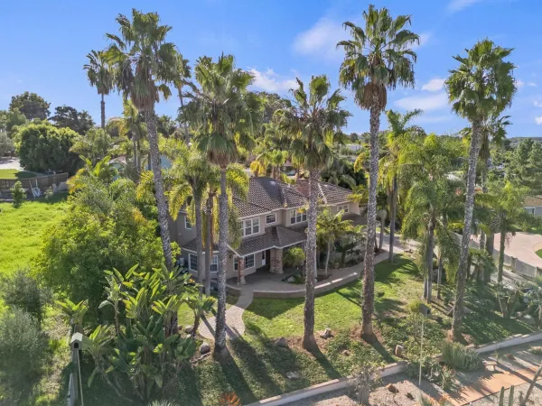a view of swimming pool with outdoor seating and plants