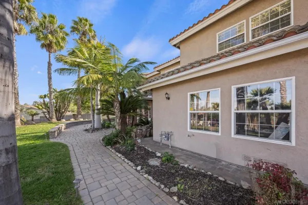 a view of a table and chairs under an umbrella
