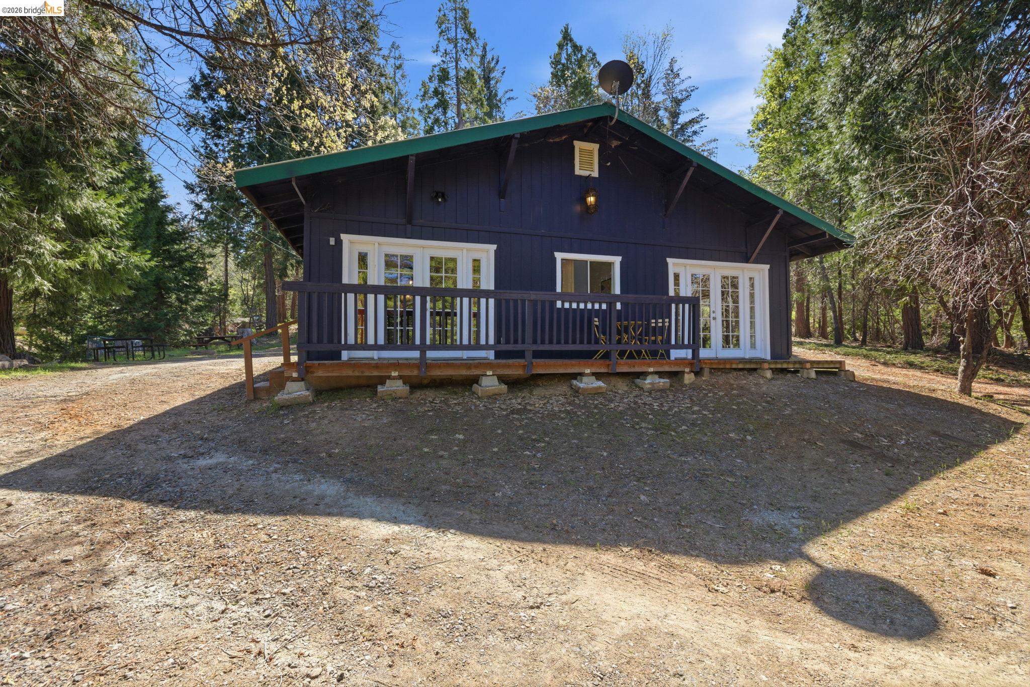 24189 South Fork Road Twain Harte, CA 95383 - Photo 29 of 34 a front view of a house with a yard