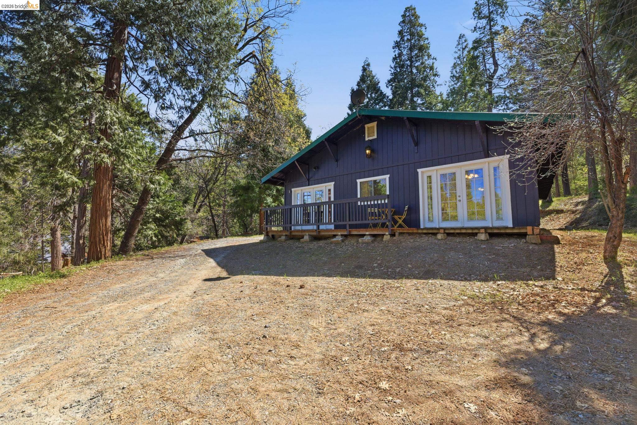 24189 South Fork Road Twain Harte, CA 95383 - Photo 30 of 34 a view of a house with a yard covered with snow