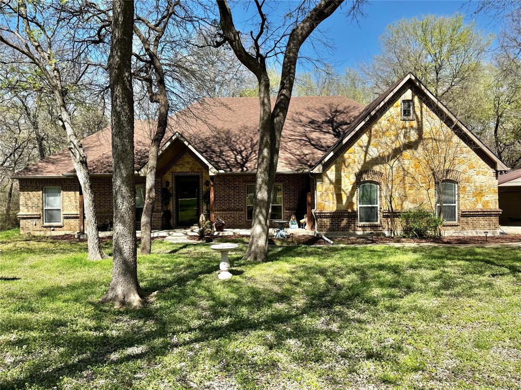 121 Rey Del Mar Circle Weatherford, TX 76085 - Photo 1 of 29 a view of a house with backyard porch and sitting area
