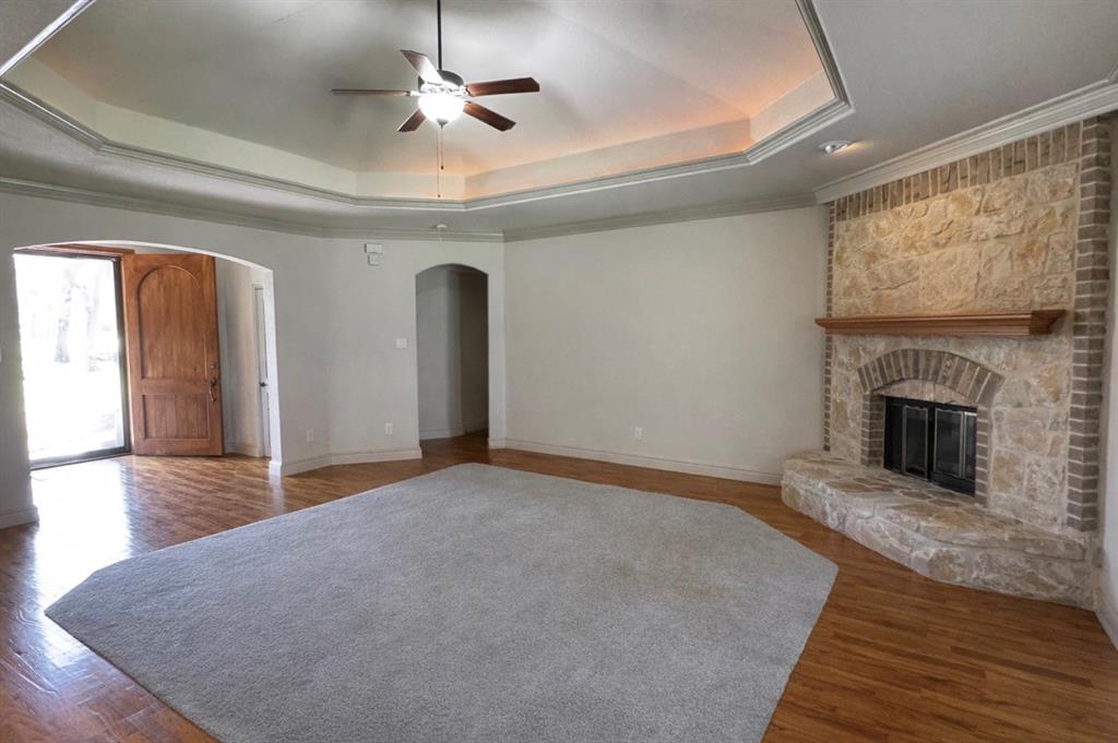 121 Rey Del Mar Circle Weatherford, TX 76085 - Photo 11 of 29 a view of an empty room with window and fire place