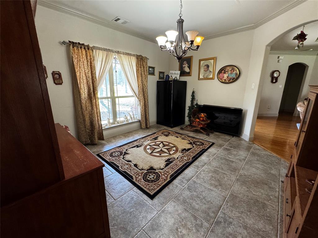 121 Rey Del Mar Circle Weatherford, TX 76085 - Photo 12 of 29 a living room with furniture and a window