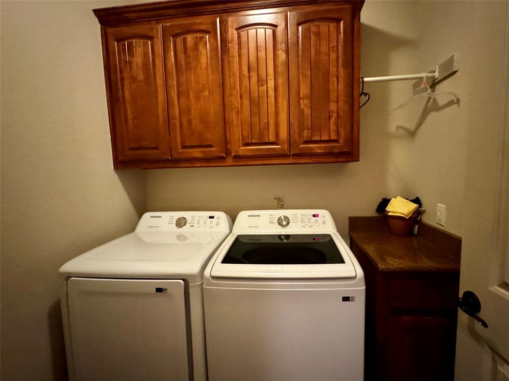 121 Rey Del Mar Circle Weatherford, TX 76085 - Photo 21 of 29 a utility room with dryer and washer