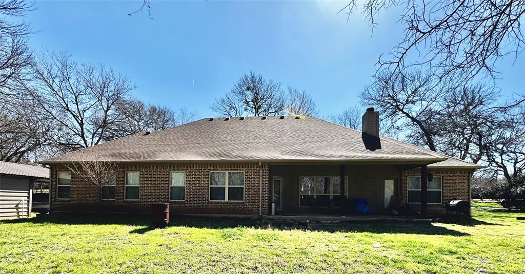 121 Rey Del Mar Circle Weatherford, TX 76085 - Photo 22 of 29 a front view of a house with a yard