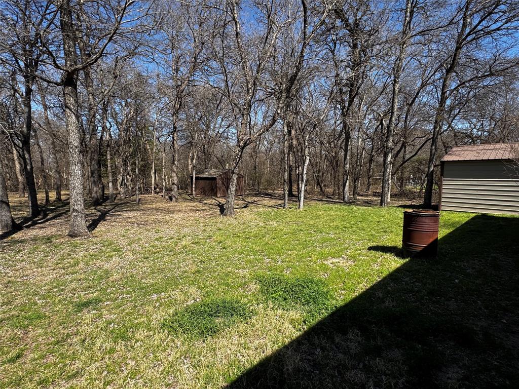 121 Rey Del Mar Circle Weatherford, TX 76085 - Photo 23 of 29 a view of outdoor space with garden