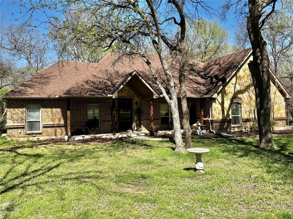 121 Rey Del Mar Circle Weatherford, TX 76085 - Photo 3 of 29 a view of a house with pool and sitting area