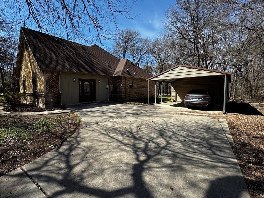 121 Rey Del Mar Circle Weatherford, TX 76085 - Photo 4 of 29 a view of a house with a snow in the yard