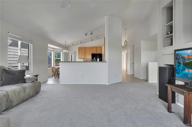 a bathroom with a granite countertop sink and a bathtub