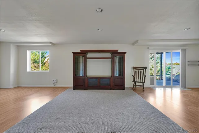 a kitchen with granite countertop a sink and a stove top oven