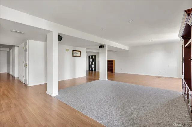 a kitchen with granite countertop a sink and cabinets