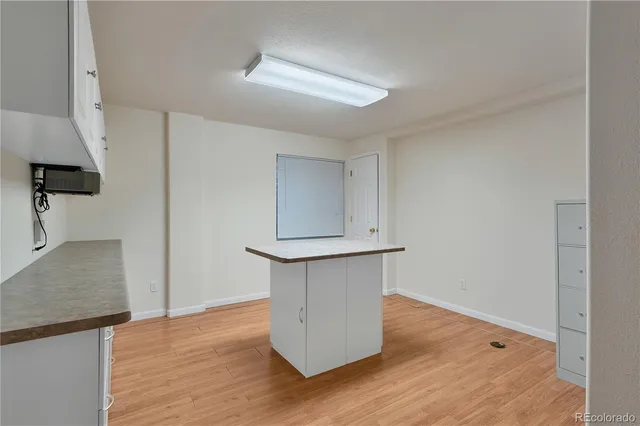 a view of a balcony with wooden floor space