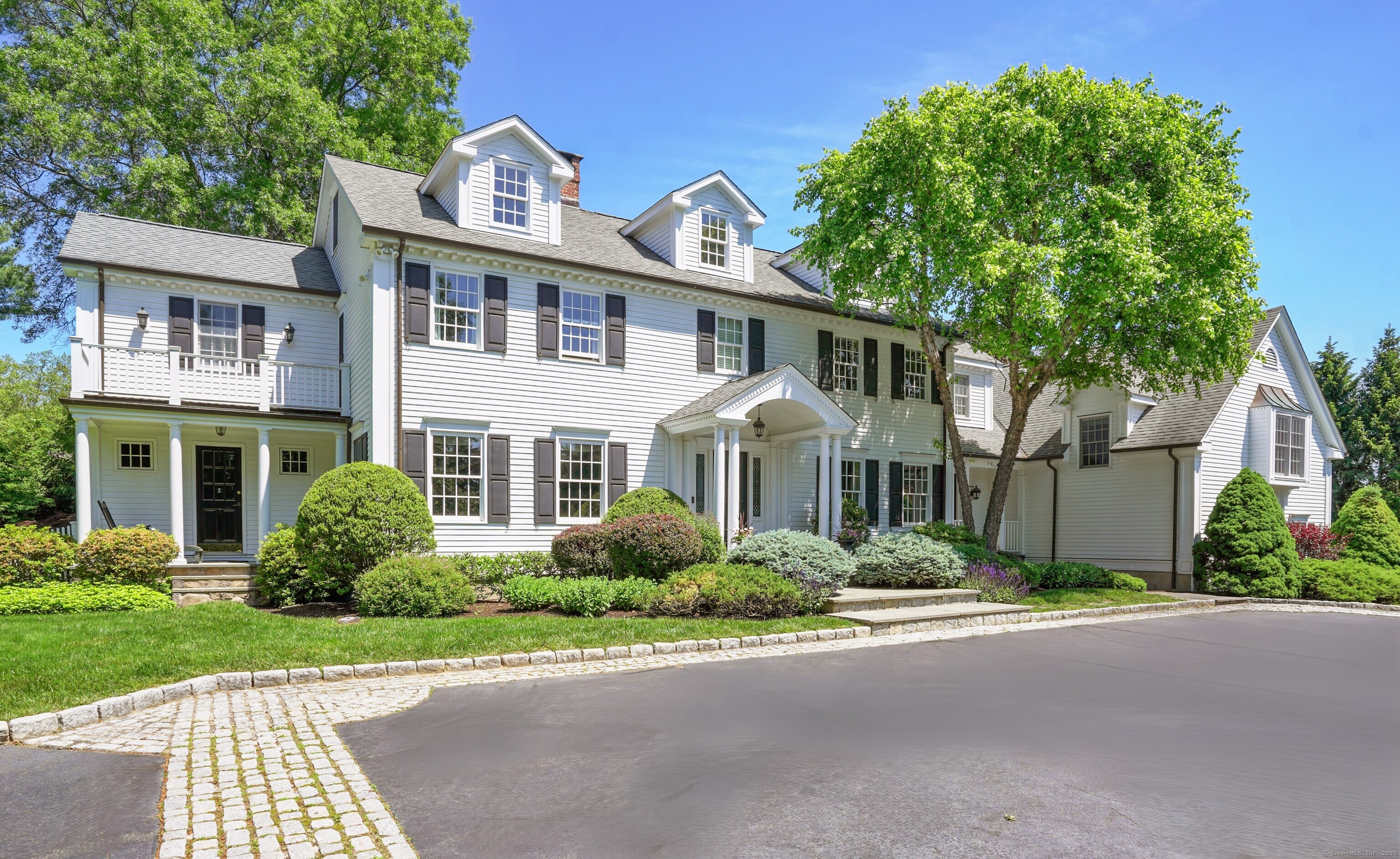 front view of a house next to a yard