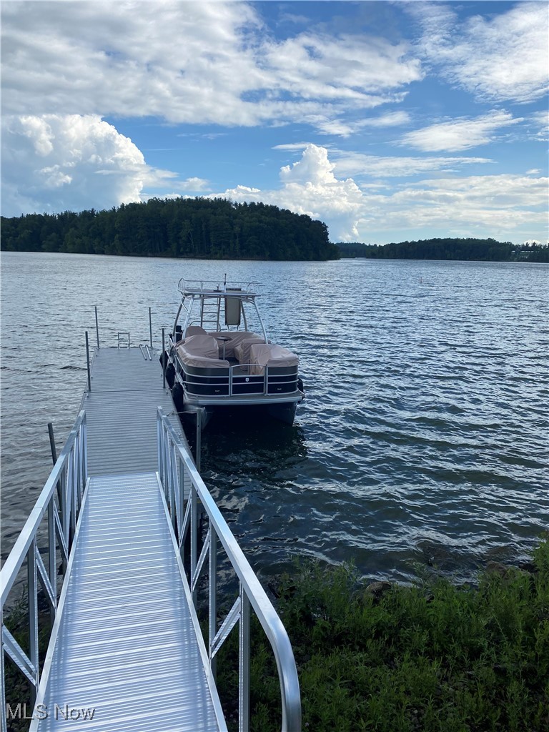 1251 Arrowhead Drive Southwest Dellroy, OH 44620 - Photo 4 of 50 For your nautical toys, is a 40' new composite floating dock with gangway directly in front of the home.