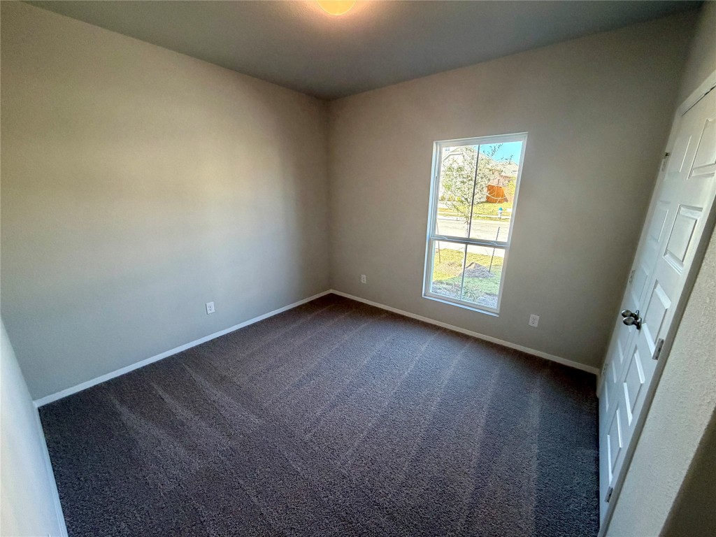 117 Rocky View Lane Georgetown, TX 78628 - Photo 9 of 17 an empty room with a window