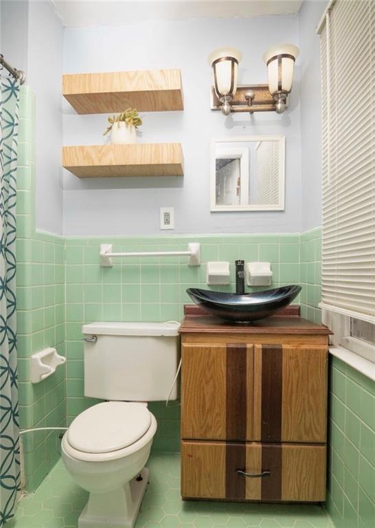 98 Almon Church Road Covington, GA 30014 - Photo 21 of 22 a bathroom with a toilet and a sink
