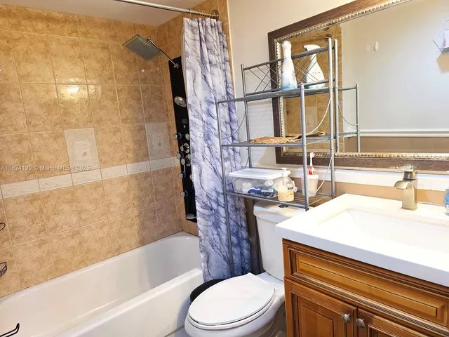 a bathroom with a sink a toilet and bathtub