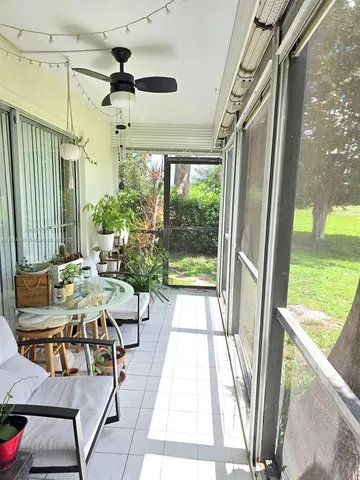 a view of a patio with a table and chairs