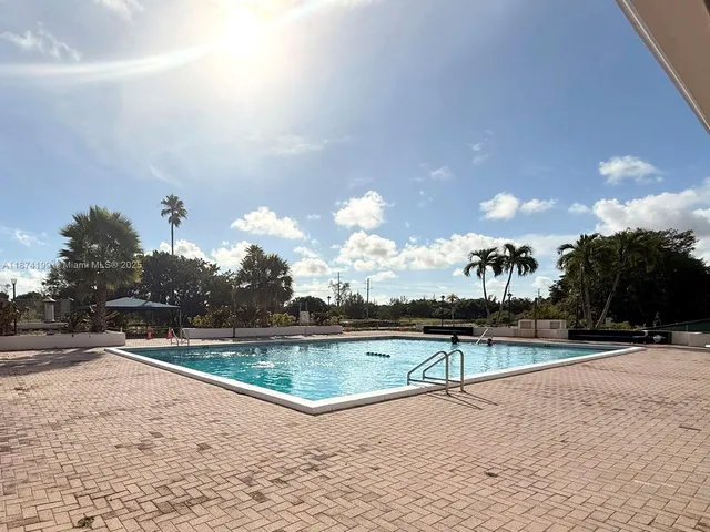 a view of a swimming pool and an outdoor space
