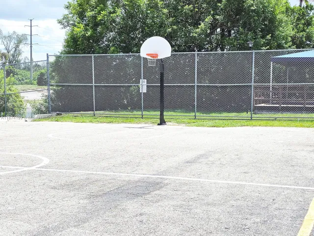 a small yard and a wooden fence