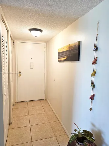a view of a livingroom with a potted plant