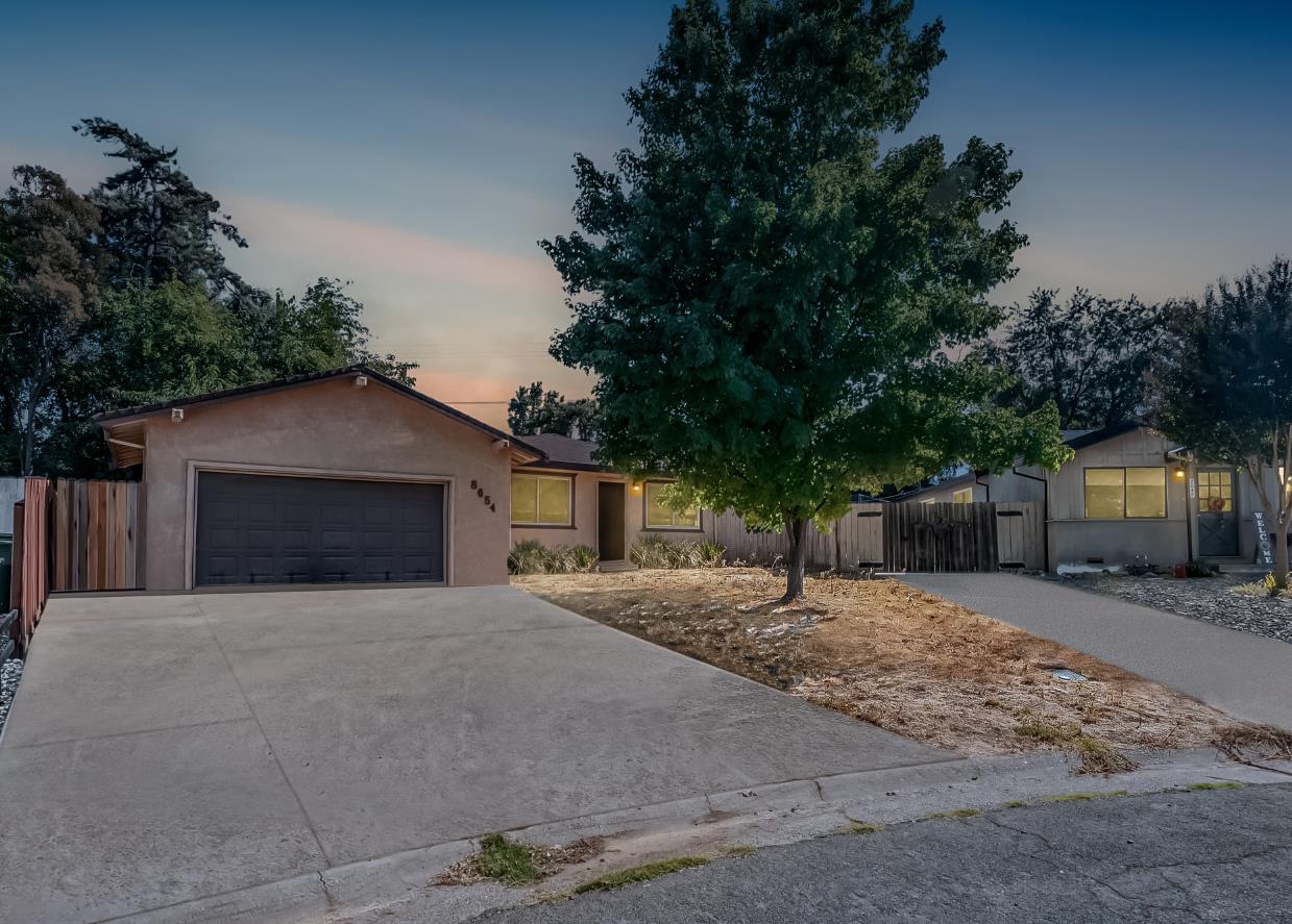 8654 Fairmont Way Fair Oaks, CA 95628 - Photo 1 of 1 a front view of a house with a yard and garage