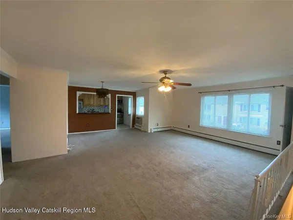 a view of empty room with windows