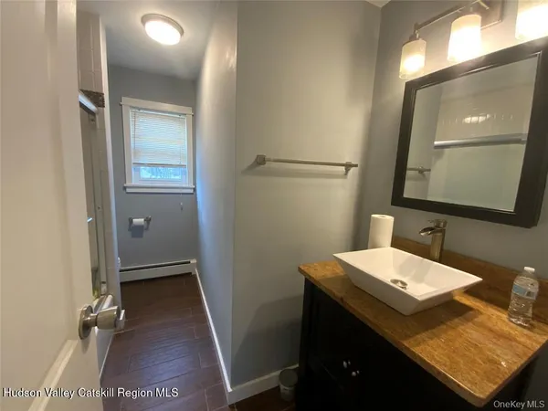 a bathroom with a sink and a mirror