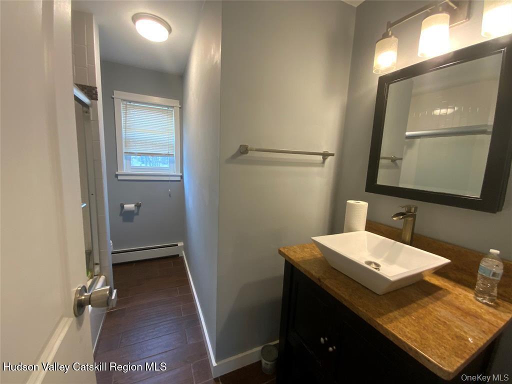 250 Beechwood Avenue Poughkeepsie, NY 12601 - Photo 7 of 7 a bathroom with a sink and a mirror