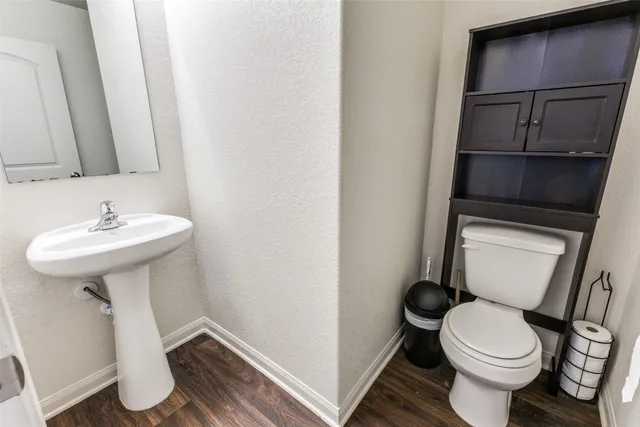 a kitchen with a sink stove and refrigerator