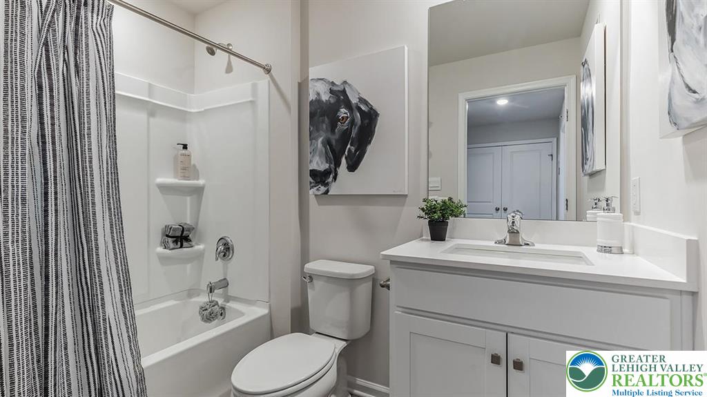1157 Martin Road Breinigsville, PA 18031 - Photo 20 of 25 a bathroom with a sink a toilet and shower