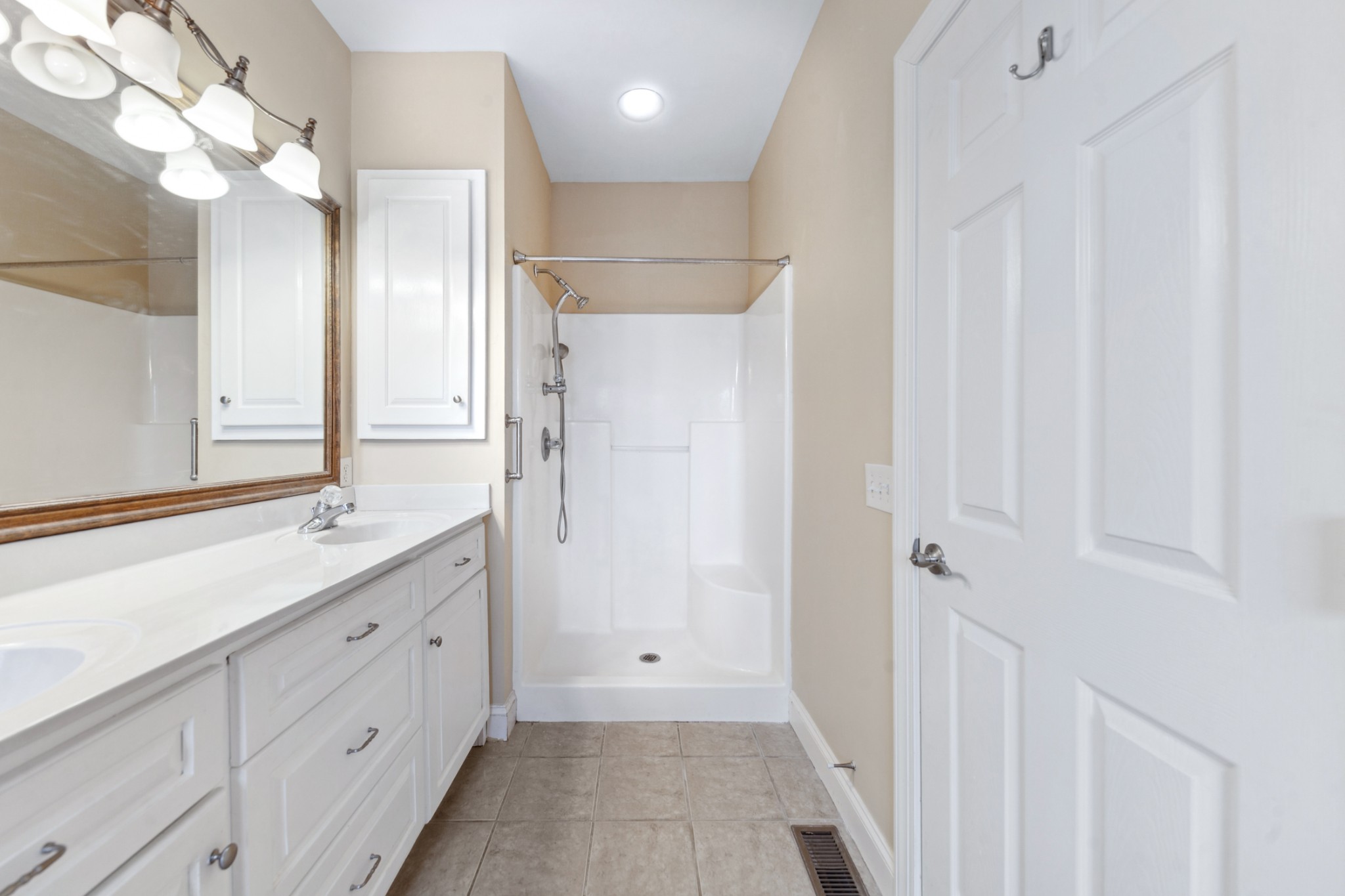 1093 Golf View Way Spring Hill, TN 37174 - Photo 27 of 46 a bathroom with a double vanity sink and a mirror