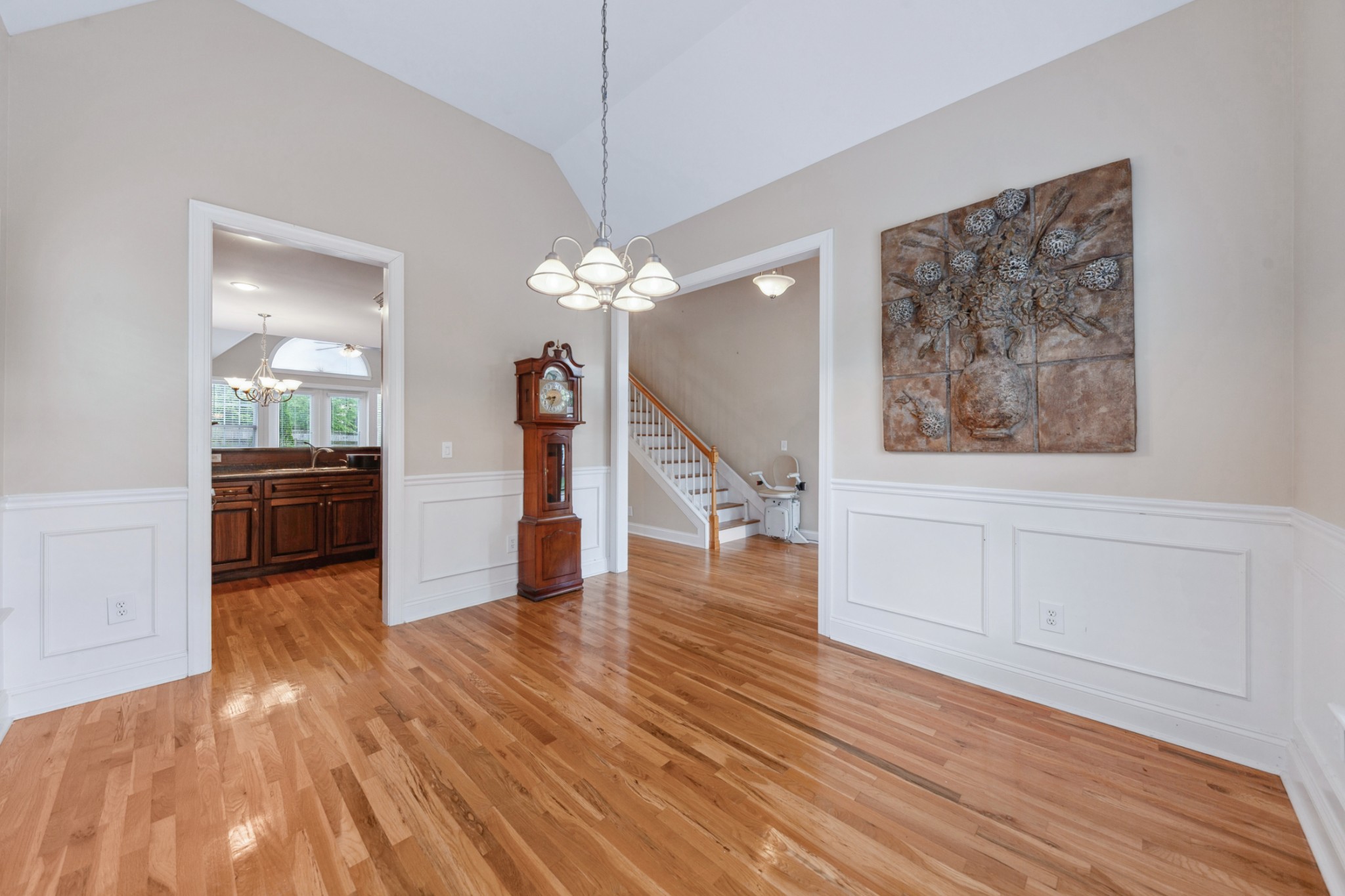 1093 Golf View Way Spring Hill, TN 37174 - Photo 7 of 46 a view of a hallway with wooden floor and staircase
