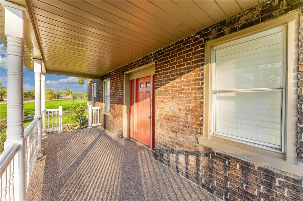 263 Goodwin Road Smithfield, PA 15478 - Photo 5 of 50 a view of a porch with wooden floor and outside view