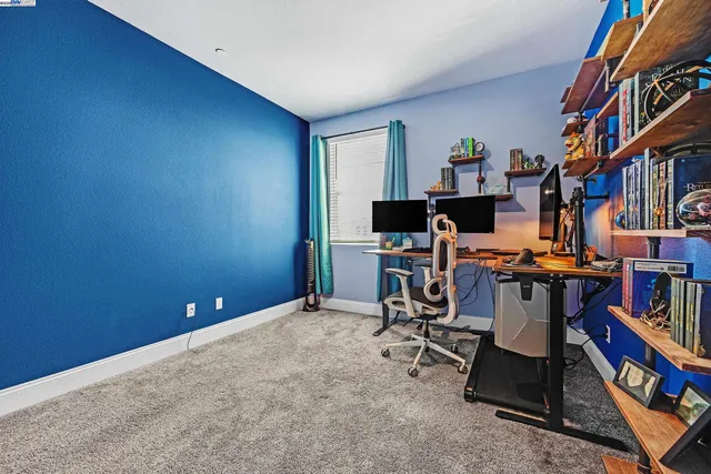 a view of a workspace with furniture