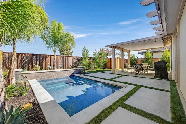 a view of swimming pool with patio